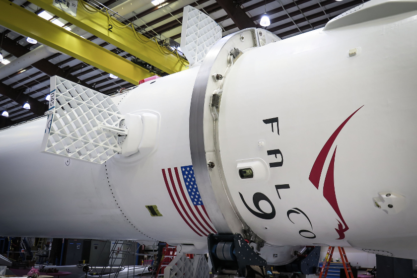 The CRS-5 Falcon 9 booster with grid fins installed and extended